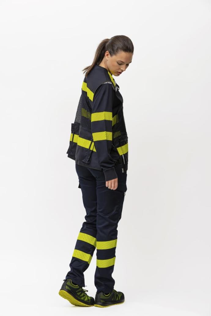 Chaleco de trabajo azul marino con tejido de rejilla y bandas de alta visibilidad amarillo flúor en Uniforma
